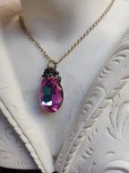 Arcane Resonance Collection – Small Handmade Bronze Pendant with Fuchsia and Amber Oval Crystal