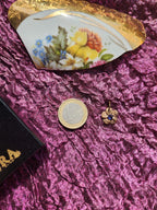 Colección Eternal Bloom – Colgante de flor de bronce hecho a mano con cristal de tanzanita.