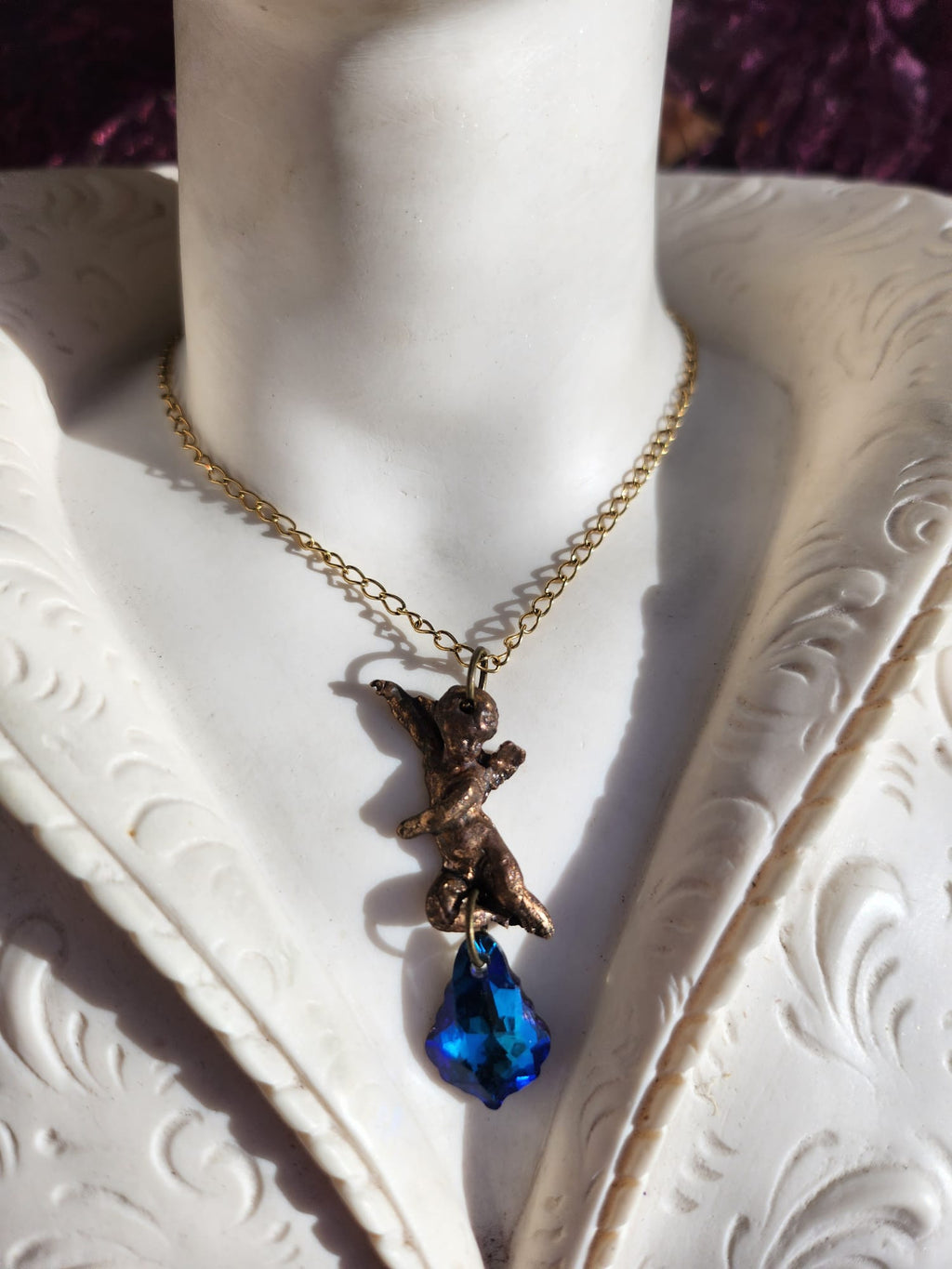 Echoes of Heaven Collection - Handmade Bronze Angel Pendant with Deep Sapphire Crystal