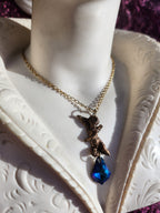 Echoes of Heaven Collection - Handmade Bronze Angel Pendant with Deep Sapphire Crystal