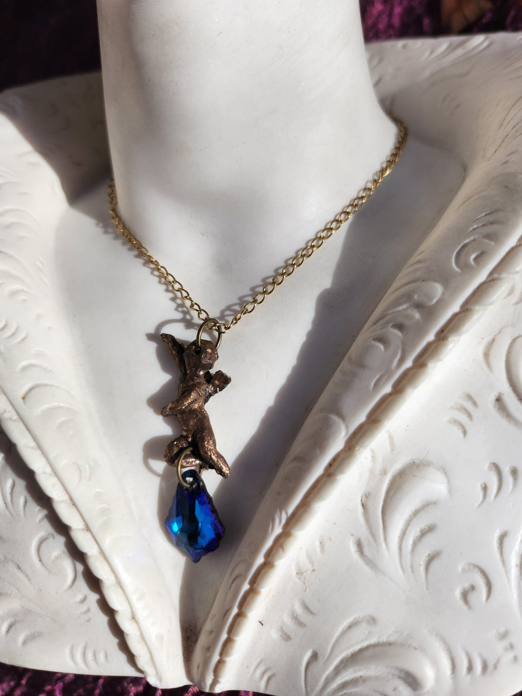 Echoes of Heaven Collection - Handmade Bronze Angel Pendant with Deep Sapphire Crystal
